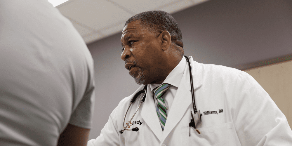 Physician with patient at medical center