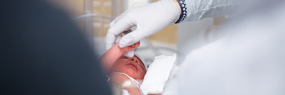 Newborn being examined by doctor