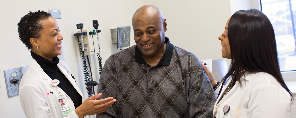 Doctor, patient and nurse talking