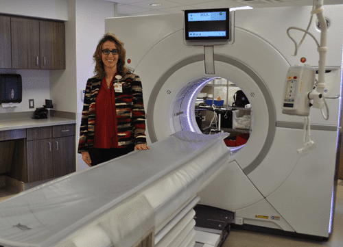 Lady next to an MRI