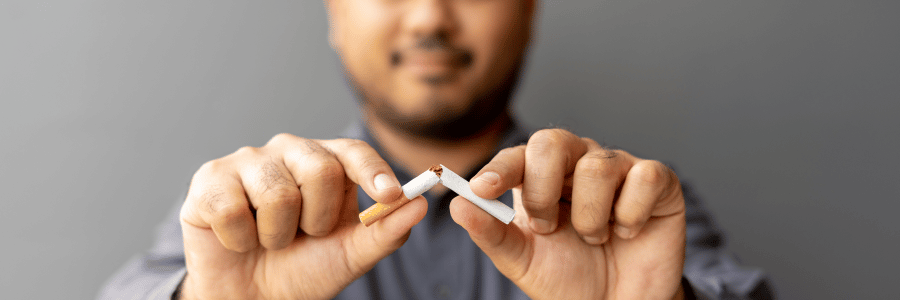Person Holding Cigarette for Five Tips to Quit Smoking
