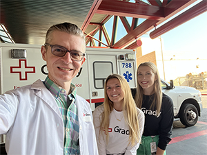 pharmacists in front of Grady ambulance